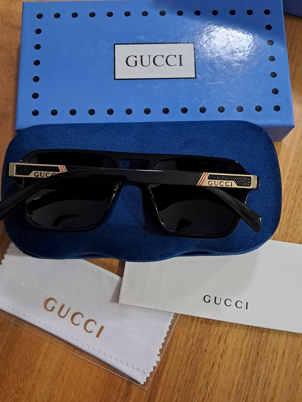 Gucci Black Sunglasses with Gold Temple Accents